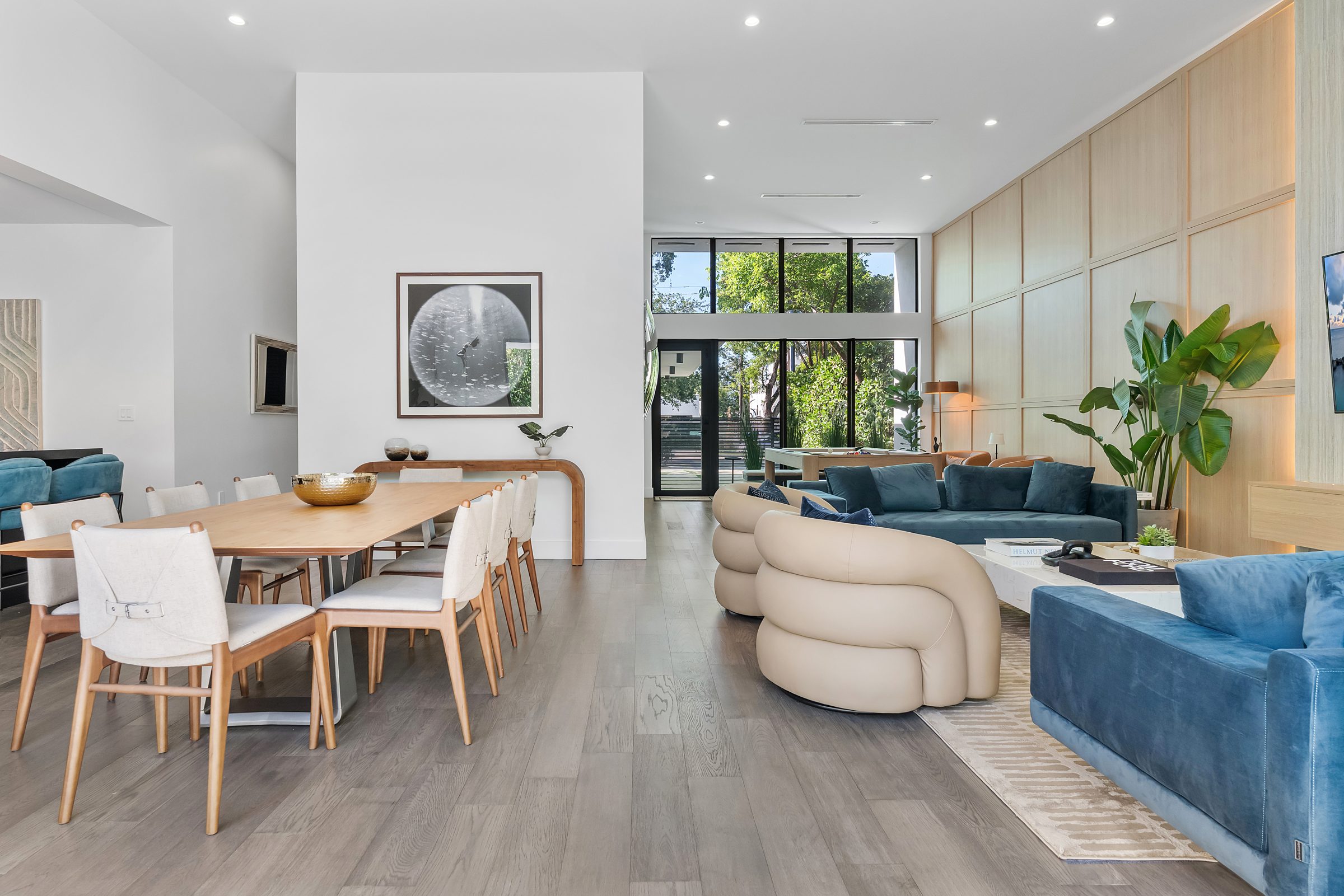 Bright open-plan living and dining room in a Los Angeles home designed by Naomi Satya Interiors