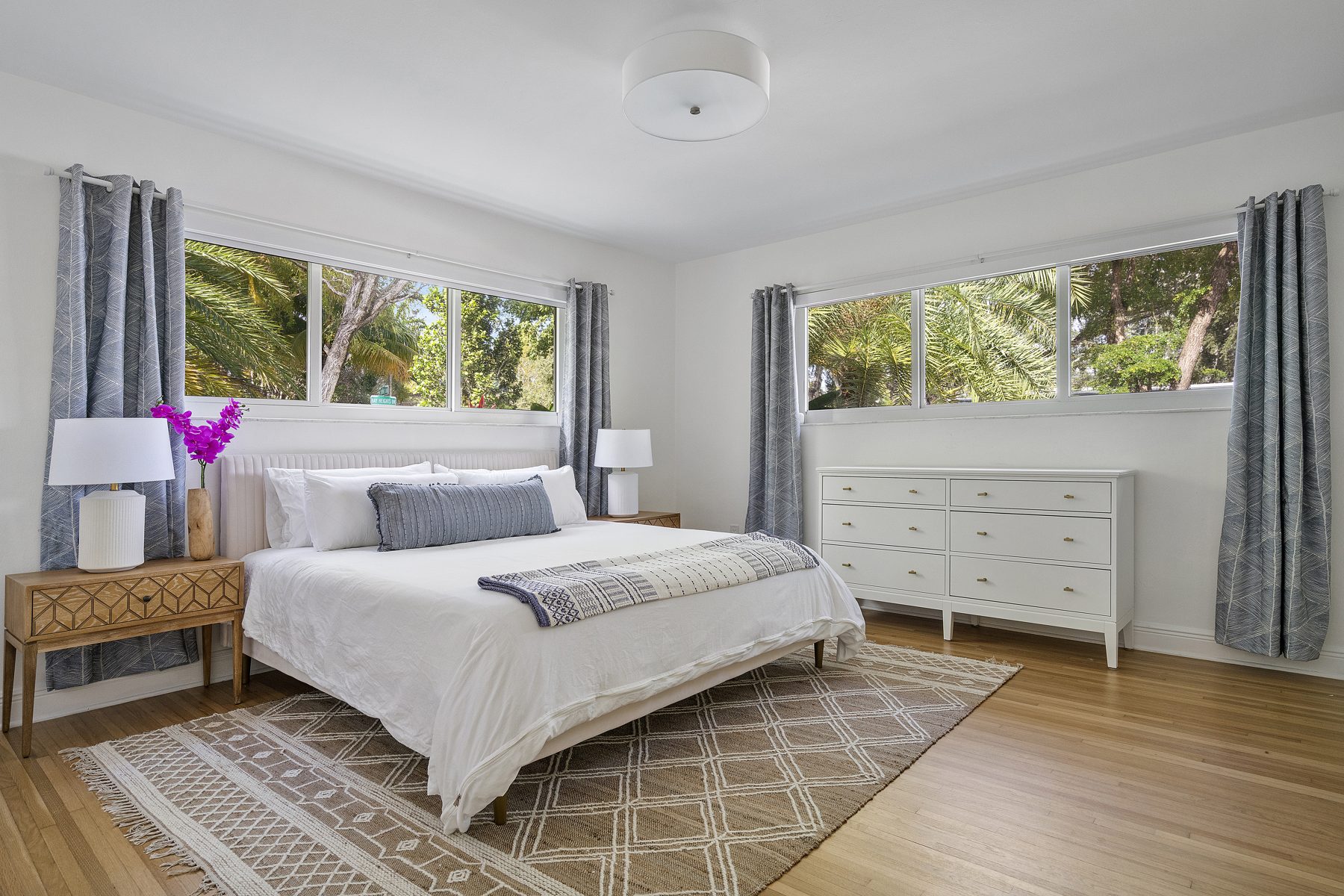 Light-filled coastal bedroom in an Orange County home by Naomi Satya Interiors