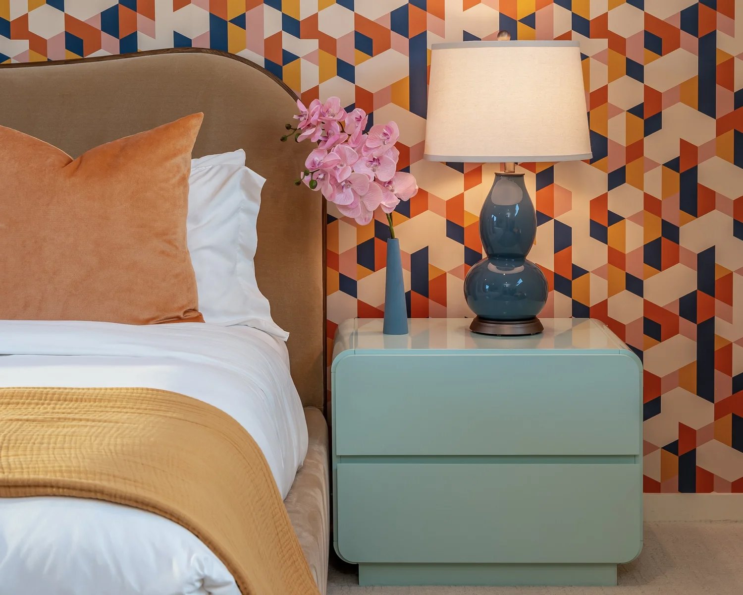 Bedroom with bold geometric wallpaper and mid-century furnishings in a Palm Springs home by Naomi Satya Interiors